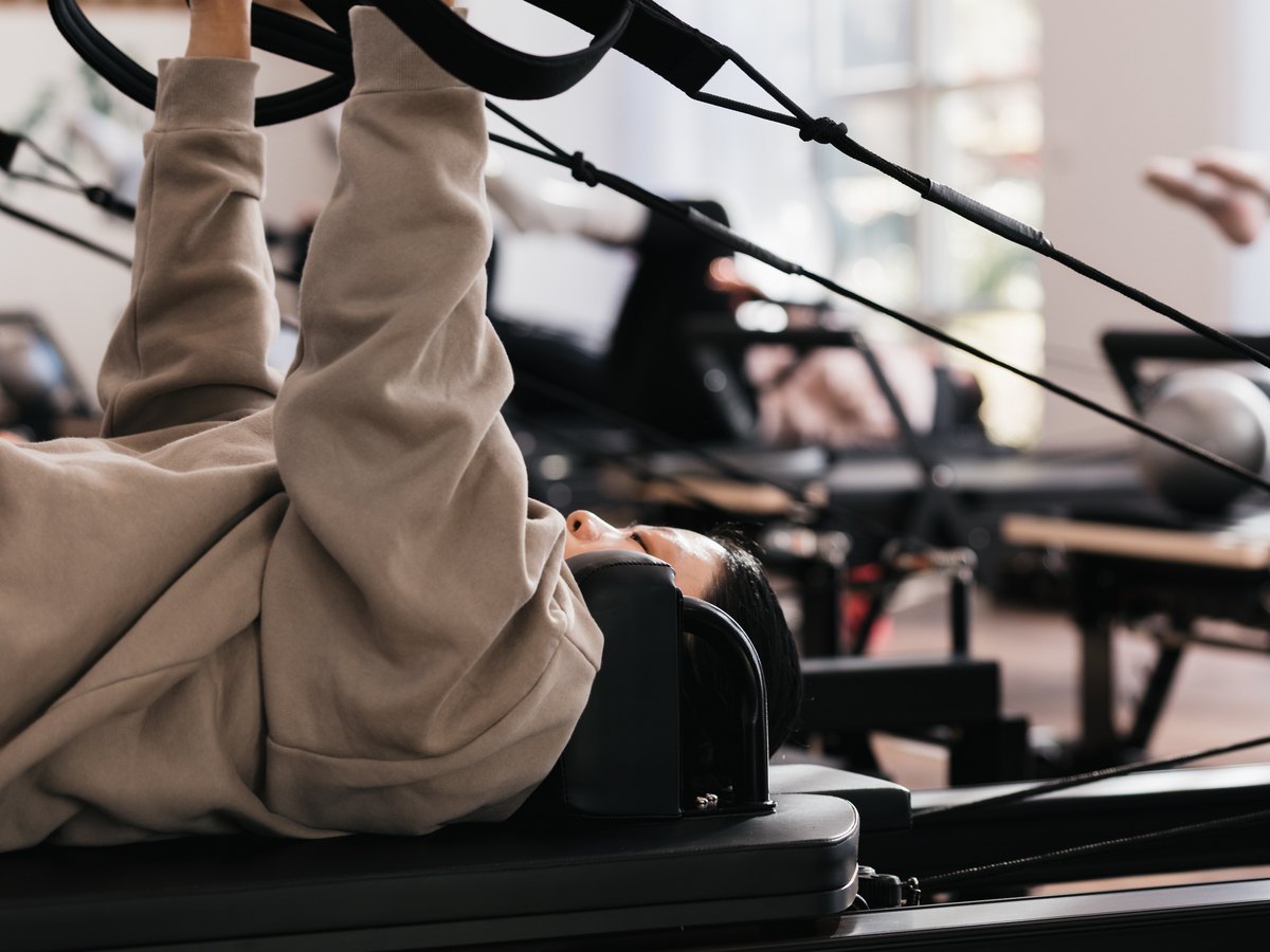 Working with the straps on the reformer in the SiSU studio