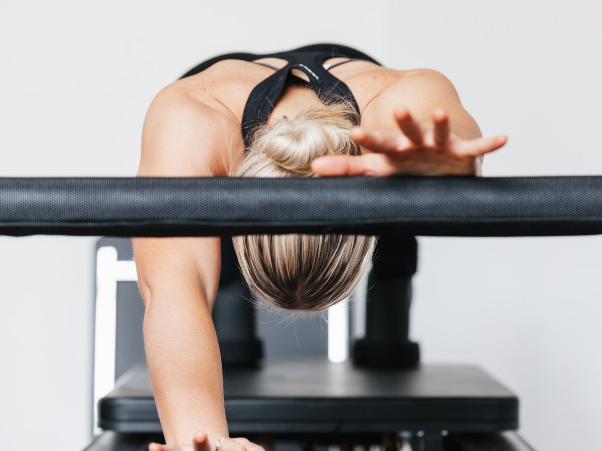 A long stretch over the reformer footbar at SiSU Canberra